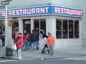Rick Hammersley in front of Seinfeld Restaurant